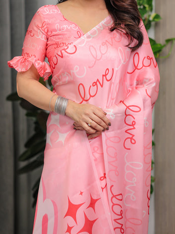 Blush Pink Satin Georgette Saree with All-Over Love Typography Print and Attached Matching Printed Blouse – 5.5 Meter Romantic Designer Saree for Valentine’s Day & Anniversary Wear